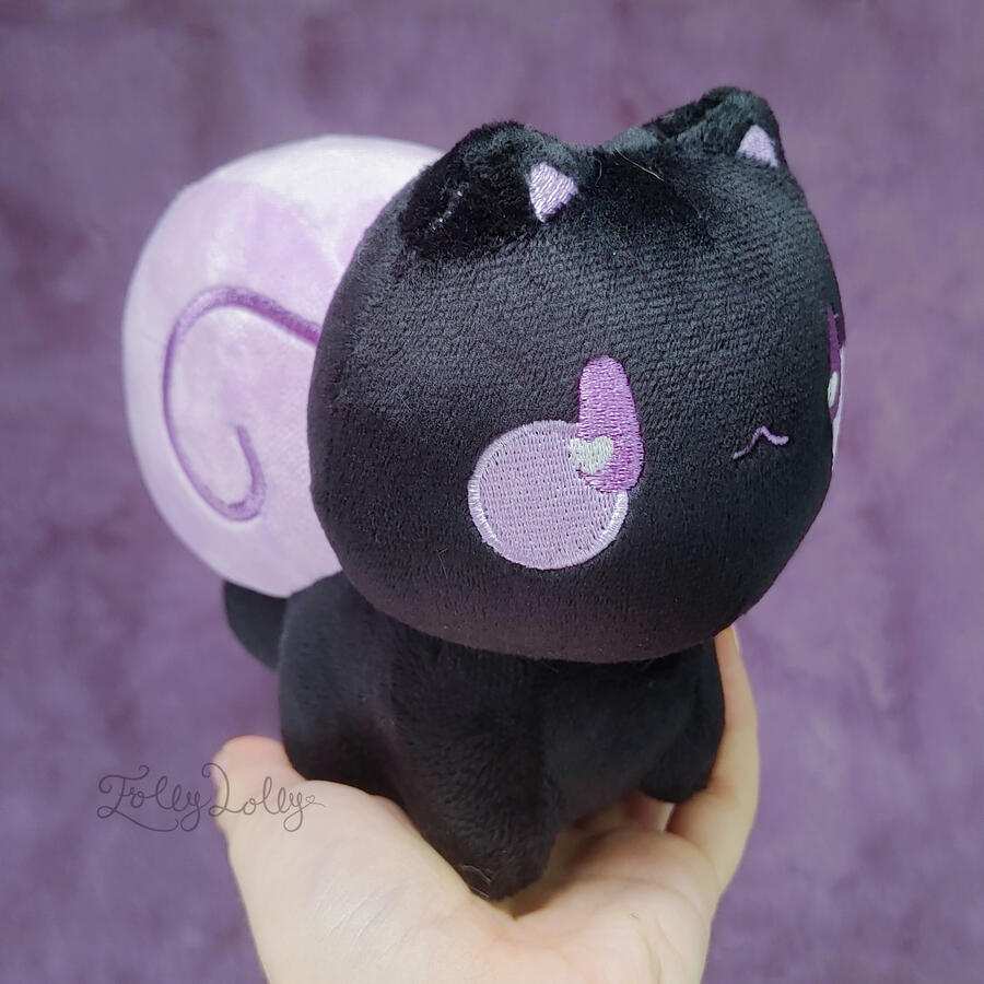 A black snail-cat plush with a purple shell