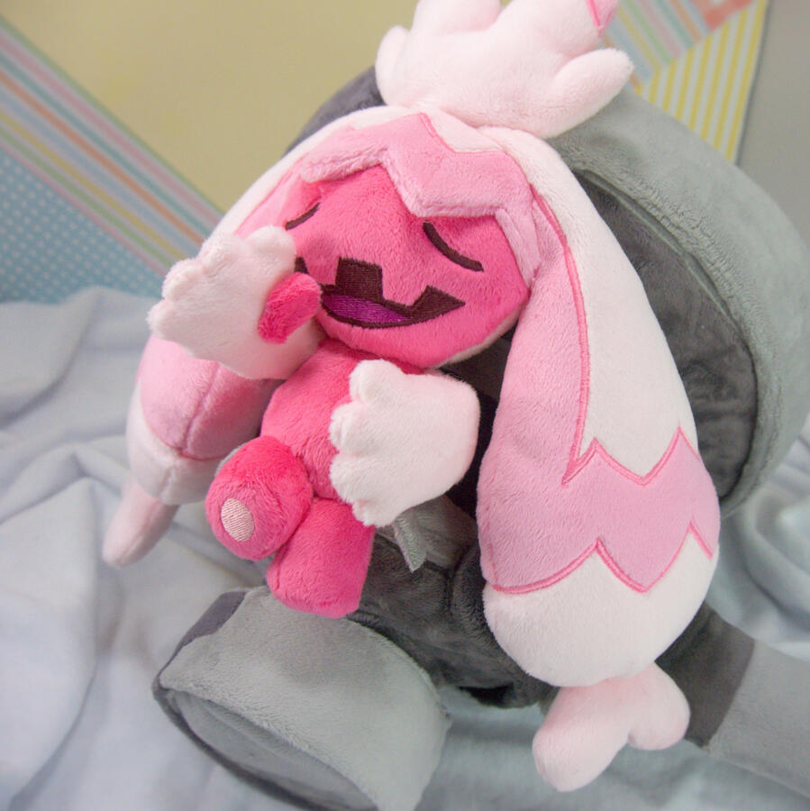 A plush of Sprigatito from Pokemon with a bong