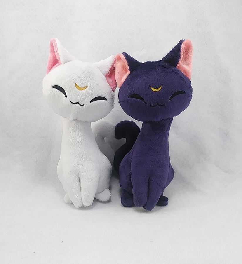 Black and white cat plushies