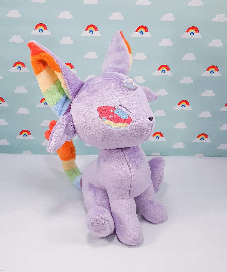 Espeon plush with rainbow accents