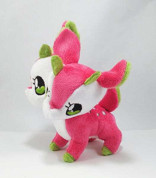 A pink and white two-headed deer plush