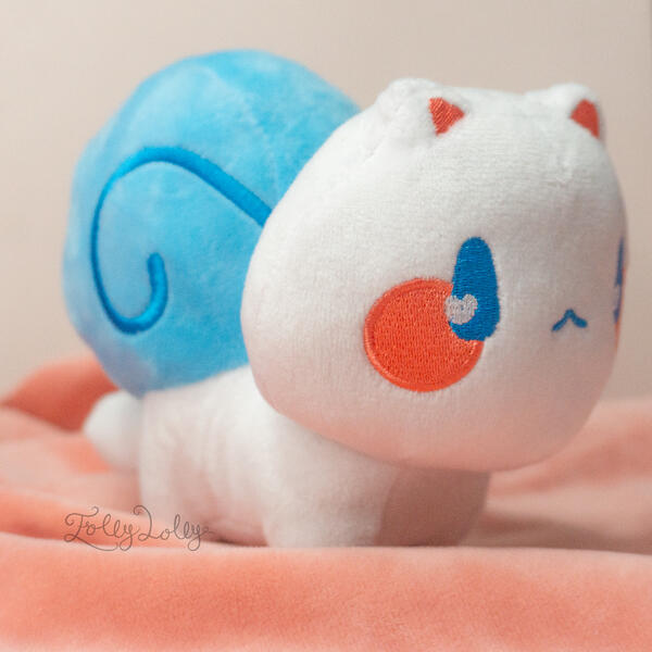 A white plush snail-cat with a blue shell