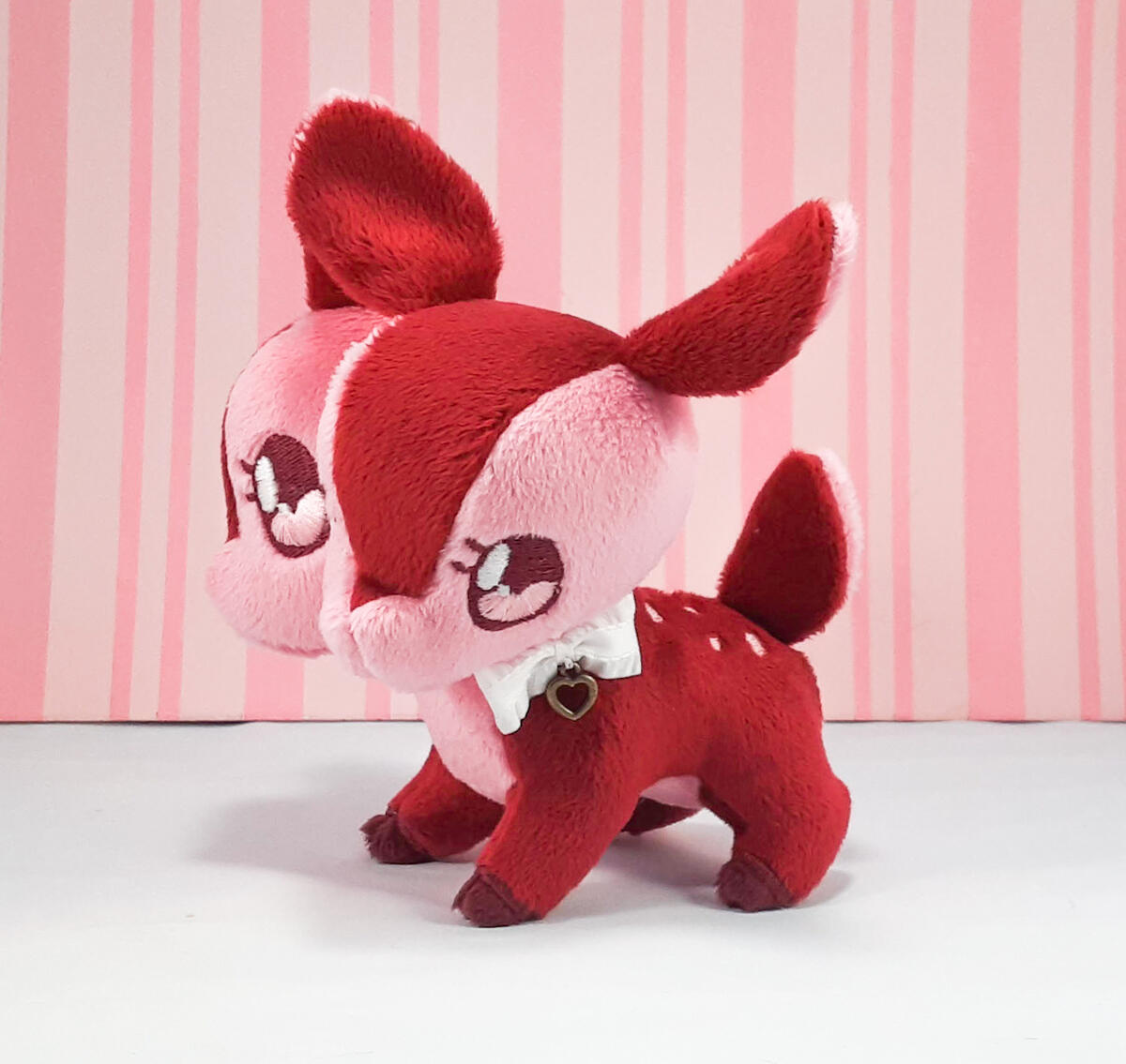 A red and pink two-headed deer plush